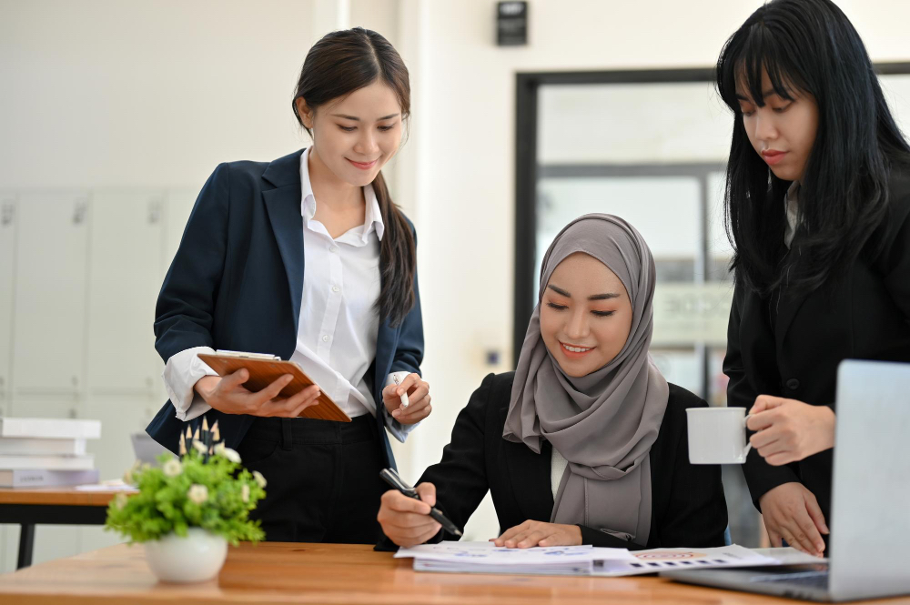 Consultants coaching a client through a pipeline review